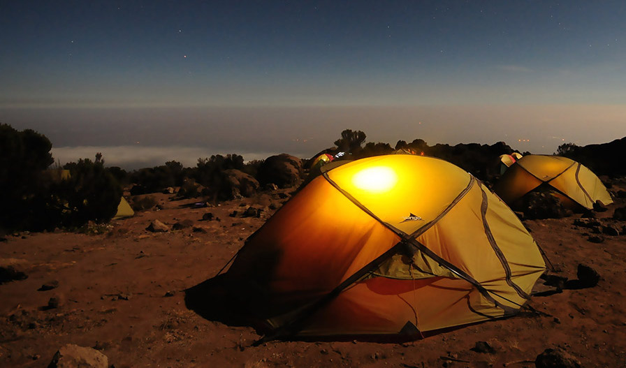 Camping in the desert with a night sky